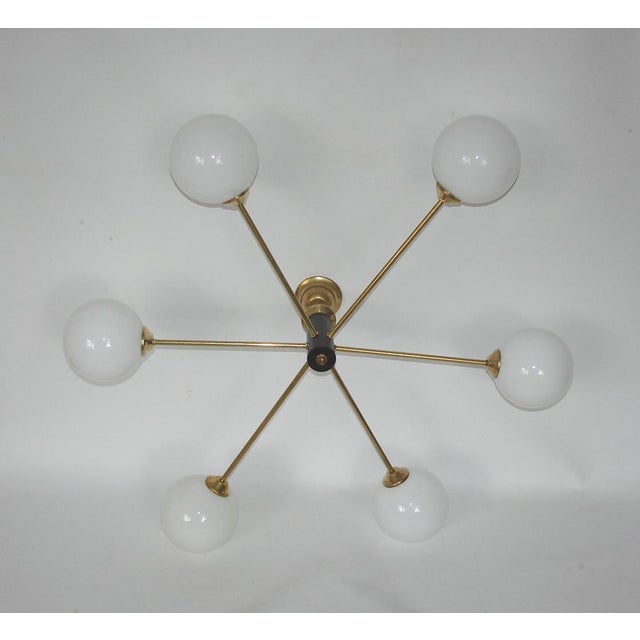 Vintage Chandelier in Brass, Glass and Metal by Stilnovo, 1960s, in Very Good conditions. Designed 1960 to 1969 Up to 250V...