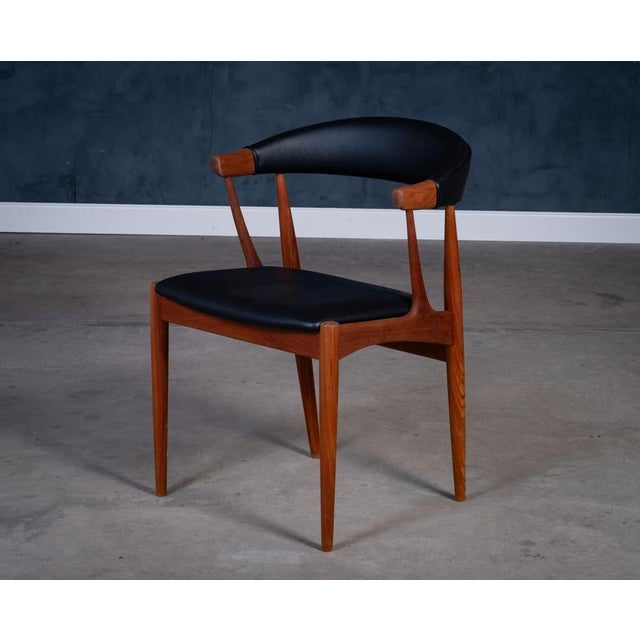 Beautiful Danish modern teak armchair, Model BA113, designed by architect Johannes Andersen and produced by Brdr....