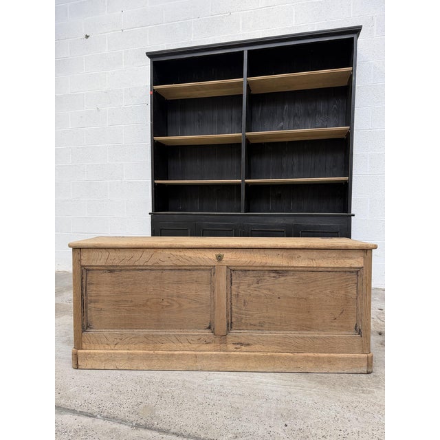 This antique solid oak chest has been fully restored. It features three large storage compartments and a working lock. It...