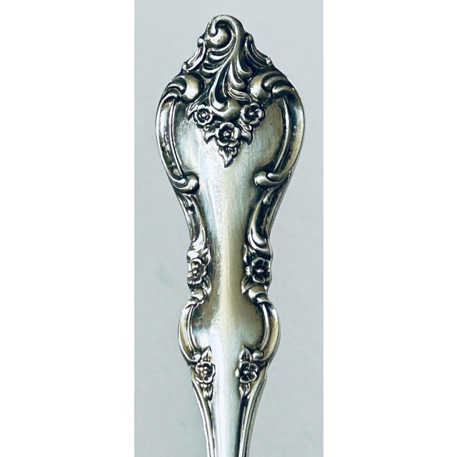 This is a silver-plated shell spoon in the Orleans pattern by International Silver. This pattern was introduced in 1964...