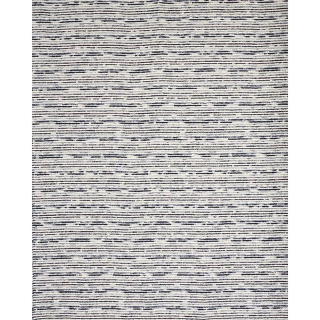 An irregular textural weave of chunky twisted bouclé yarns, Tomori Indoor/Outdoor is a high-performance fabric with the...