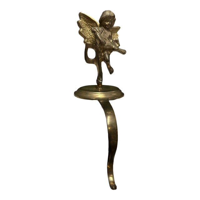 Antique Brass Cherub Stocking Holder For Sale