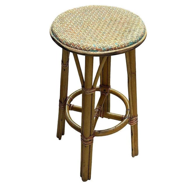 Original 1960 Triple-strand "Arched" Rattan bar stools with multi-color woven seats. The stool features four large arches...