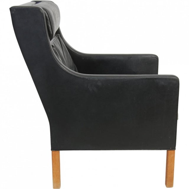 Børge Mogensen 2431 lounge chair upholstered in original black leather, and with oak legs. The chair is from the 1980s and...