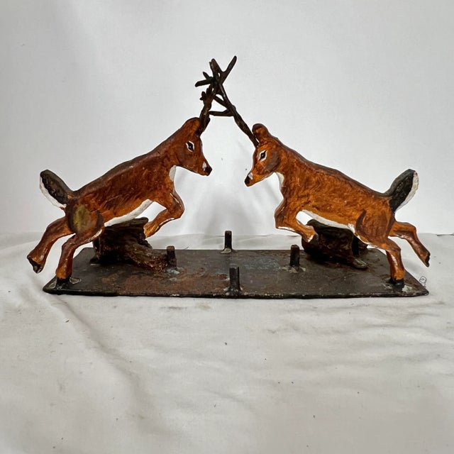 Antique early 1900s handmade cast iron fighting whitetail deer stags. Mounted on a base with logs also in cast iron. Works...
