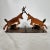 Antique early 1900s handmade cast iron fighting whitetail deer stags. Mounted on a base with logs also in cast iron. Works...
