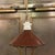 Early 20th century, industrial, factory pendant light with brown enameled, cone shape, metal shade and porcelain fitter is...
