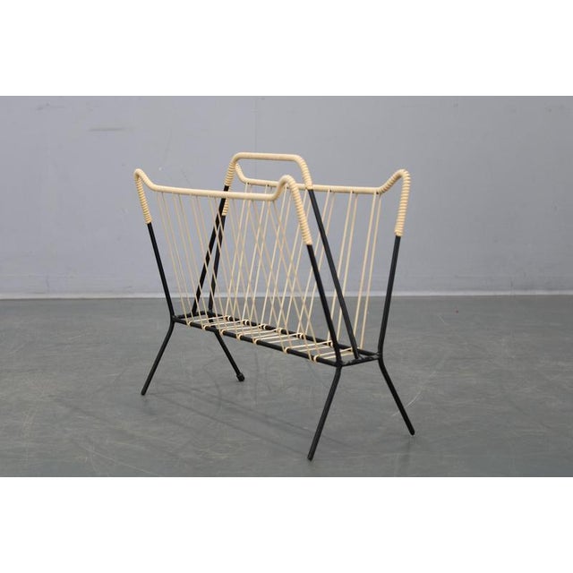 This elegant Mid Century Modern magazine and newspaper holder was produced in Italy in the 1960s. Crafted from lacquered...