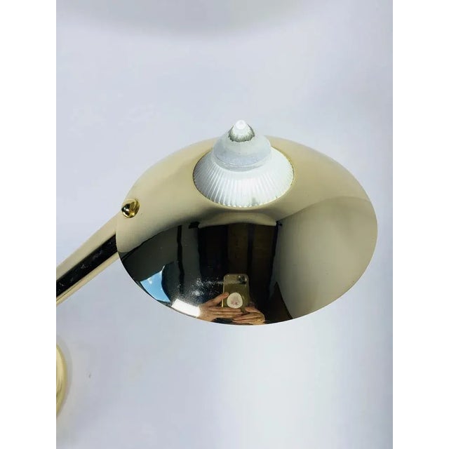 Very nice post-modernist lamp 1980, by Larrelco Milano Italy. The lamp is made of gold metal, uses a halogen bulb, and has...