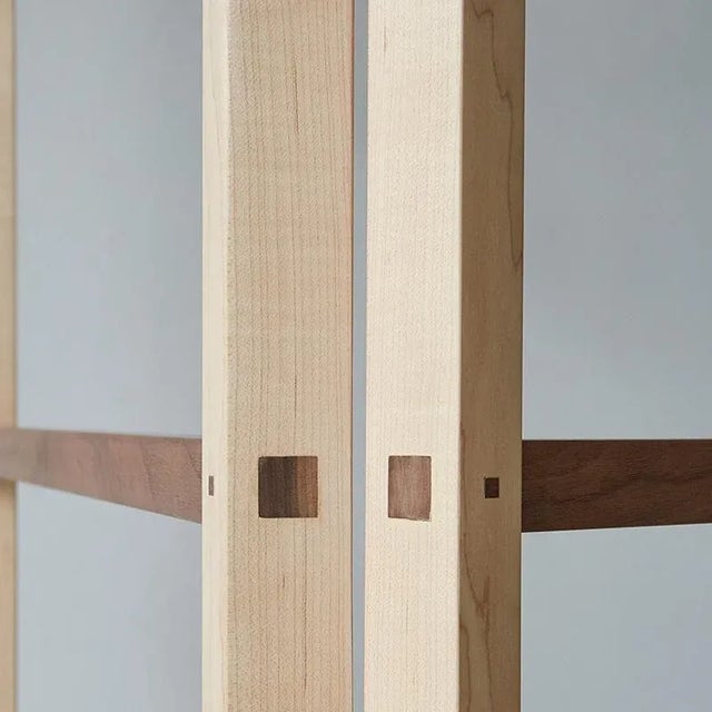Boundary is a vertical folding structure divided into three sections each moving 180 degrees. The frame is made from maple...