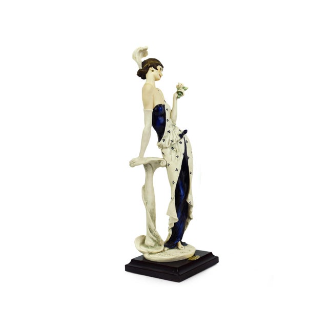 Capture the effortless elegance of the Art Deco era with "Camille," a stunning porcelain figurine by the renowned Italian...