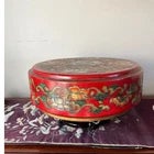This striking 14-inch diameter round storage box features a vibrant cinnabar-red finish, meticulously decorated with...