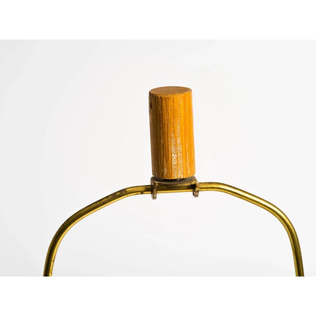 1950s wood and leather strap table lamp with matching finial.