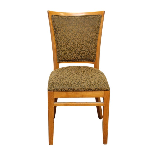 Traditional style medium toned wood dining chair with foliate green on brown upholstery on the back and seat. Manufactured...