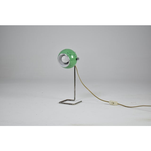 Playful Italian vintage Space Age desk lamp with an adjustable ball shade in apple-green speckled enamel and a satin-white...