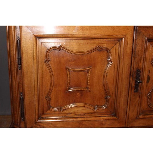 Louis XIV buffet in walnut, it opens with two doors and two drawers, quadrilobed ground doors, original cornice, 18th...