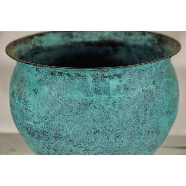 "About the Item This set of three vintage Indian copper cachepots presents a cohesive grouping unified by a richly...