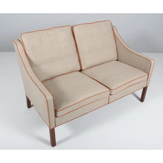 Børge Mogensen two-seat sofa new upholstered with canvas and tan aniline leather. Legs of mahogany. Model 2209, made by...