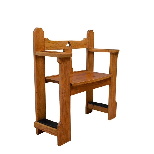 This exceptionally handsome Arts and Crafts oak hall bench, circa 1900, offers an elegant, space-saving solution for a...