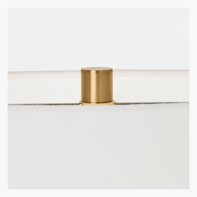 The Aura table lamp by Hable features a unique two-legged design, providing a modern twist on traditional table lamps. The...