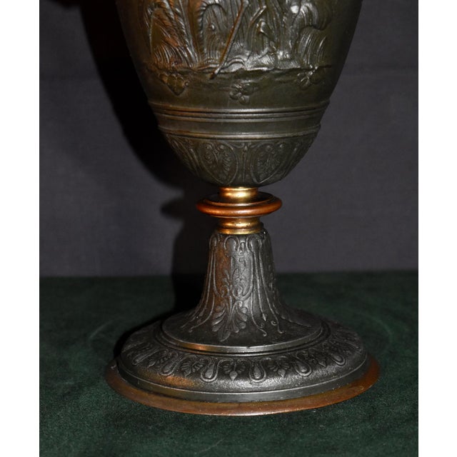 Vintage (1950's) Urn has a French Style. Made of Mixed Metals with Figural Cherubs and Cranes. Bronze Colored Finish. The...
