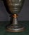 Vintage (1950's) Urn has a French Style. Made of Mixed Metals with Figural Cherubs and Cranes. Bronze Colored Finish. The...