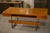 Large "Minister" desk in wood (veneer with pronounced grain), typical of 1970s French design. Generous, glossy top rests...