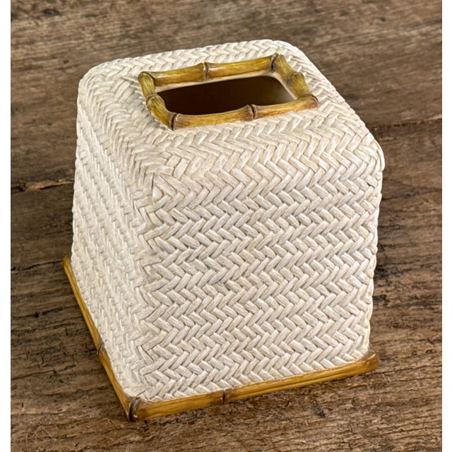 This tissue box cover by Nicole Miller NYC features a woven herringbone pattern rendered in cream colored resin. The...