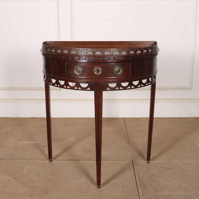 Pretty early 19th century Dutch oak demi-lune console. 1830. This piece is designed in the style of the selected designer...