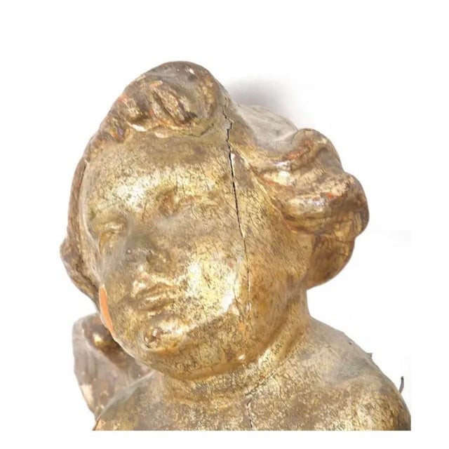 18th Century Pair of carved and gilt Italian Baroque Carved Putti. The Putti, or winged child figures, are finished in a...