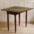 Historic folding table from the 19th century, stylistically classified as Biedermeier, featuring a folding top and an...