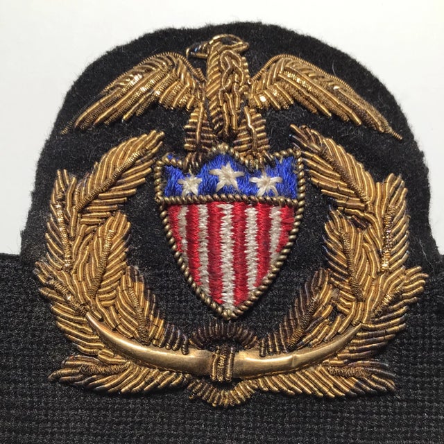 Here is a hard to find circa 1920s United States Shipping Board (USSB) officer hat badge on an elasticized band. The...