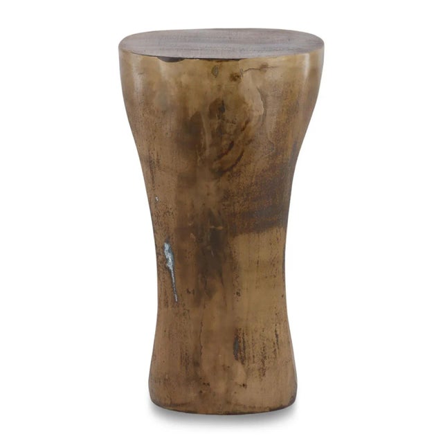 Organic modern antiqued brass finish aluminum stool or side table with hole cutout in middle of base. Artistic design and...