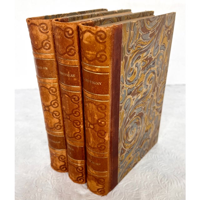 Imported from France. Set of three leather bound books from 1928. A beautiful addition to your library or room decor....