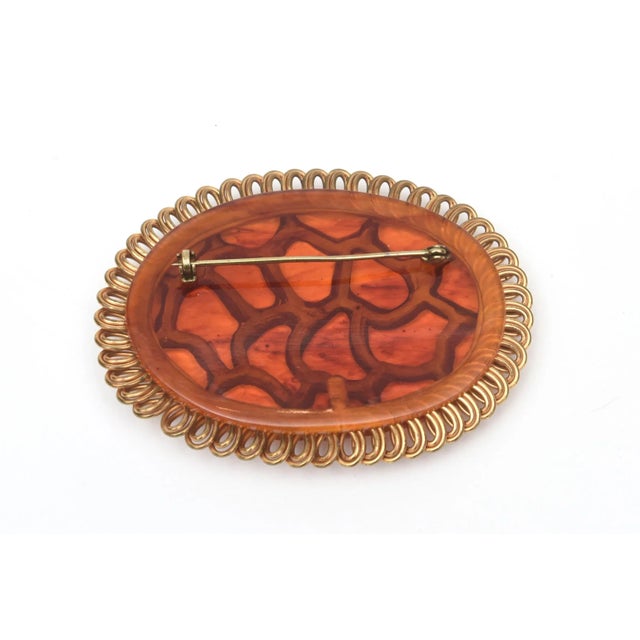 Metal Art Deco Orange Amber Brown Bakelite and Looped Brass Carved Oval Pin Brooch For Sale - Image 7 of 8