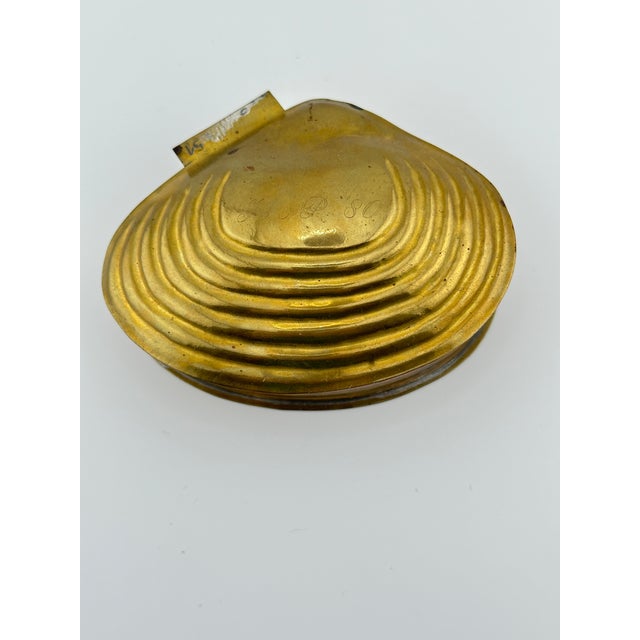 Brass shell trinket box. This is a pre owned item so please see all pictures and ask any questions.