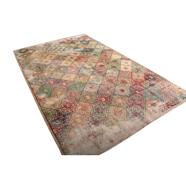 Hand knotted in Turkey originating between 1960-1970, this vintage mid-century wool rug is the latest to join our Mid-...