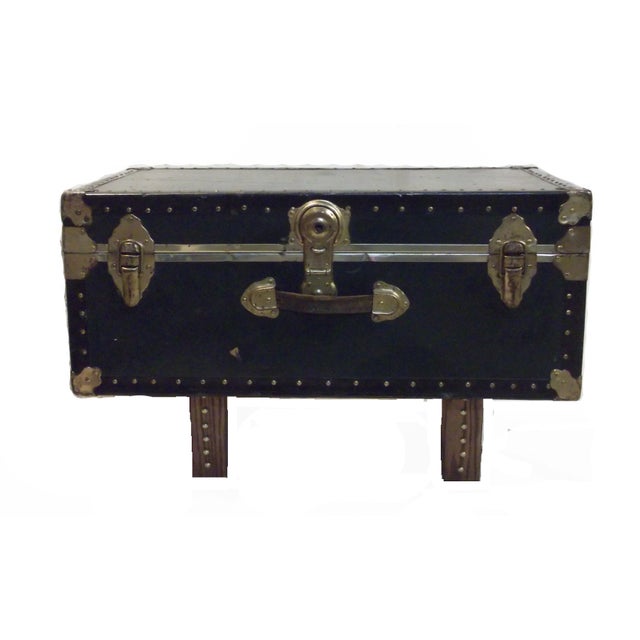 Vintage mid century coffee table/footlocker trunk. Standing on solid pine supports, this footlocker is the American...