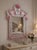 Venetian Mirror with Light Pink Murano Glass Floral Decoration Murano, Venice, Italy, Mid-20th Century An elegant...