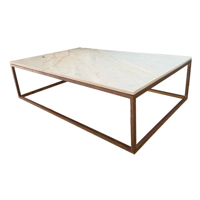 Custom-made white marble coffee table with brass base. The base is untreated, so it has a lovely patina, but it can be...