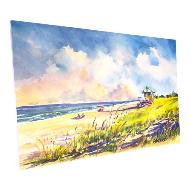 Capture the beauty of a serene beach day with this vibrant color by Florida artist Lois Brezinski. Soft clouds drift above...