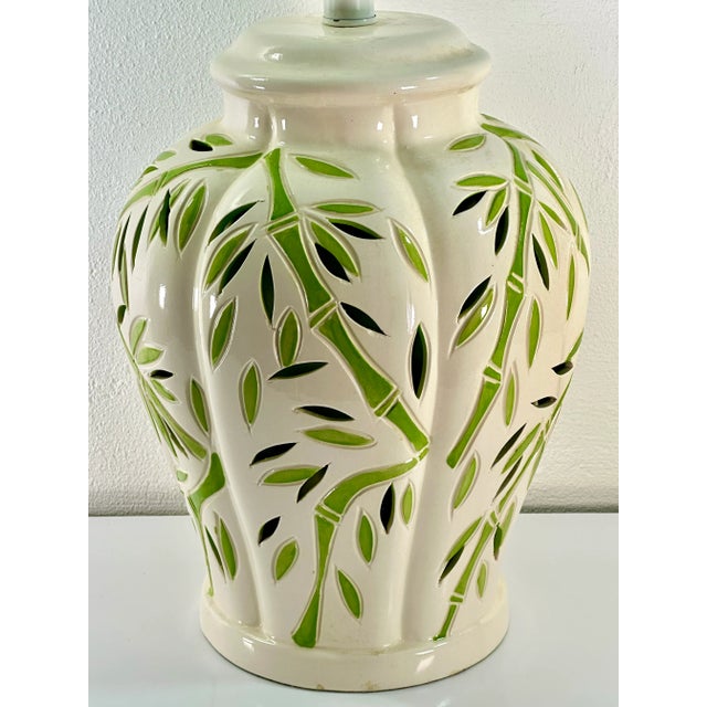 Large scale vintage table lamp from Sunset Cosco Lamps. The glossy cream base has hand cut foliate slits and an interior...