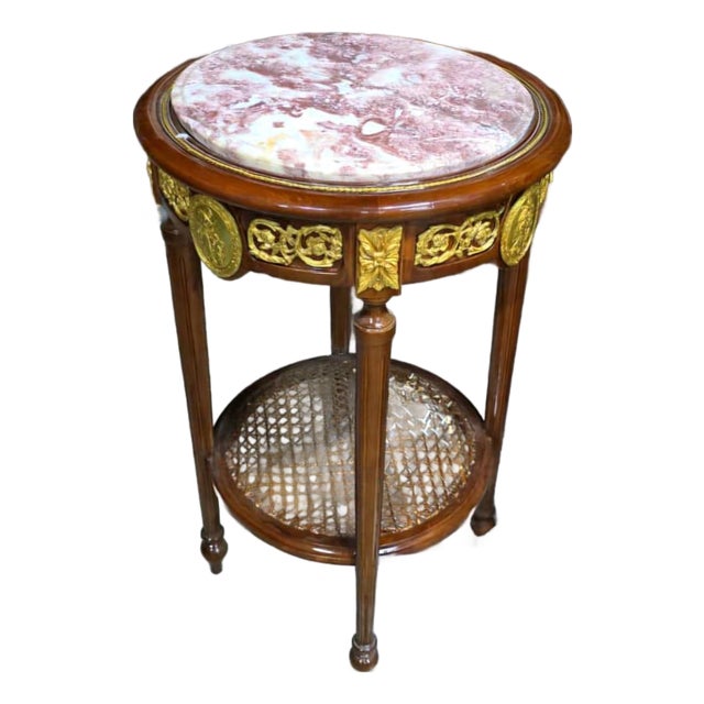 French Louis XVI Marble Top Side Table With Hand-Carved Wood Frame, Gold Leaf Accents & Cane Shelf For Sale