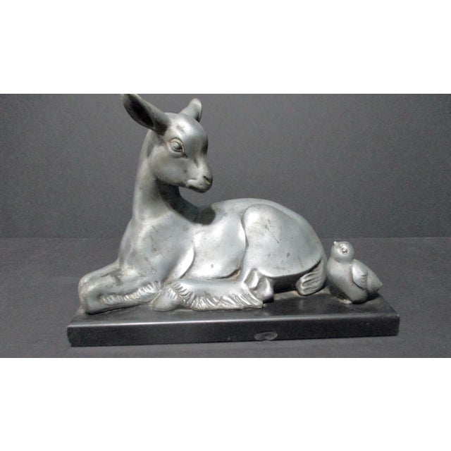 Beautiful and fine figural construction of a young goat and a chick meeting. Beautiful linear Art Deco, likely a Swedish...