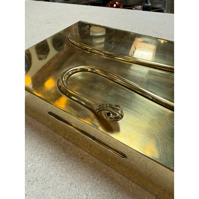 Rectangular Italian brass box featuring a sculptural snake in relief across the lid, its sinuous form adding a bold...