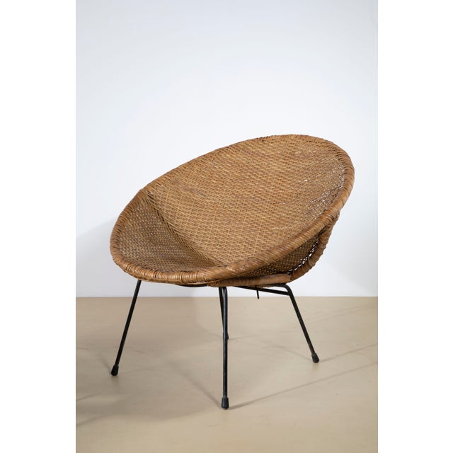 An exceptional and highly architectural pair of mid-century modern cone-shaped lounge chairs (often referred to as bucket...