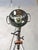 An industrial floor lamp built from an original Bosch Eisemann military searchlight, once used on military vehicles, as a...