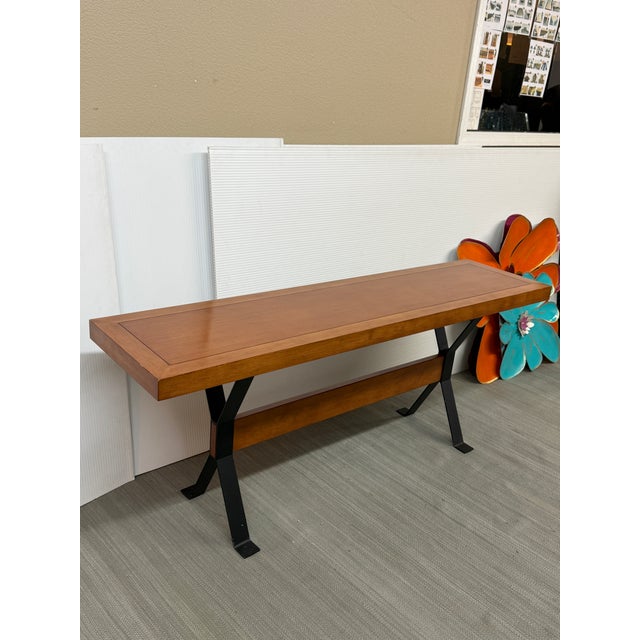 Design Plus Gallery presents a Modern Walnut Console Table on a Blackened Steel Trestle Base. The rectangular walnut top...