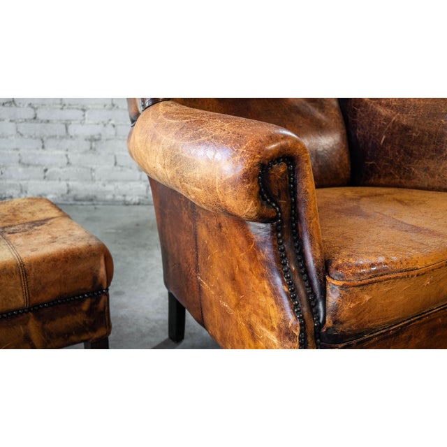 Brown 1970s Vintage Art Deco Distressed Cognac Leather Wingback Chair & Ottoman For Sale - Image 8 of 16