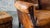 Brown 1970s Vintage Art Deco Distressed Cognac Leather Wingback Chair & Ottoman For Sale - Image 8 of 16